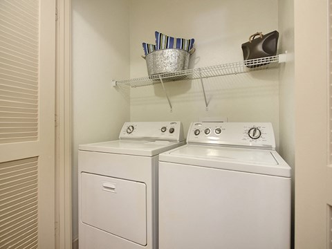 Model apartment home full washer and dryer in laundry area